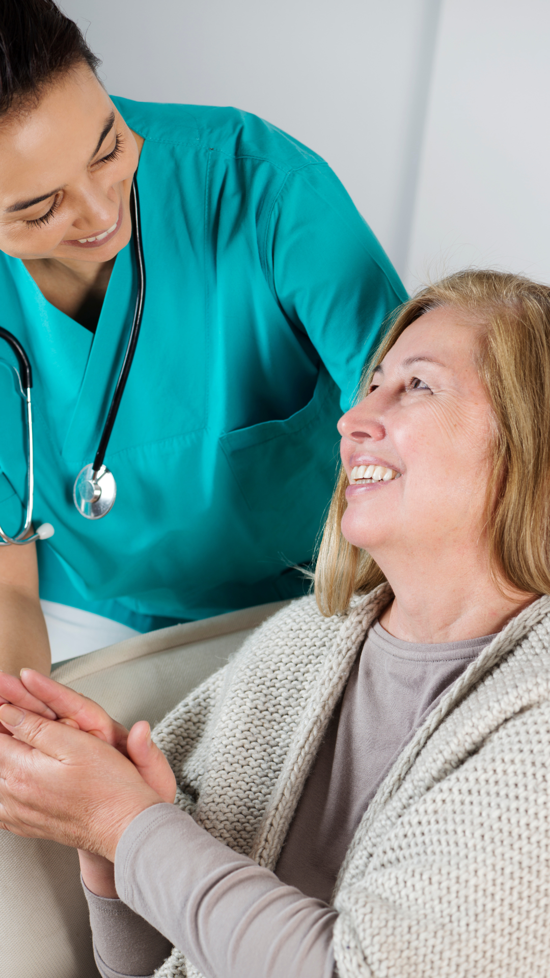 A woman with curly blonde hair, resting her head on her hand, gazing thoughtfully into the distance.